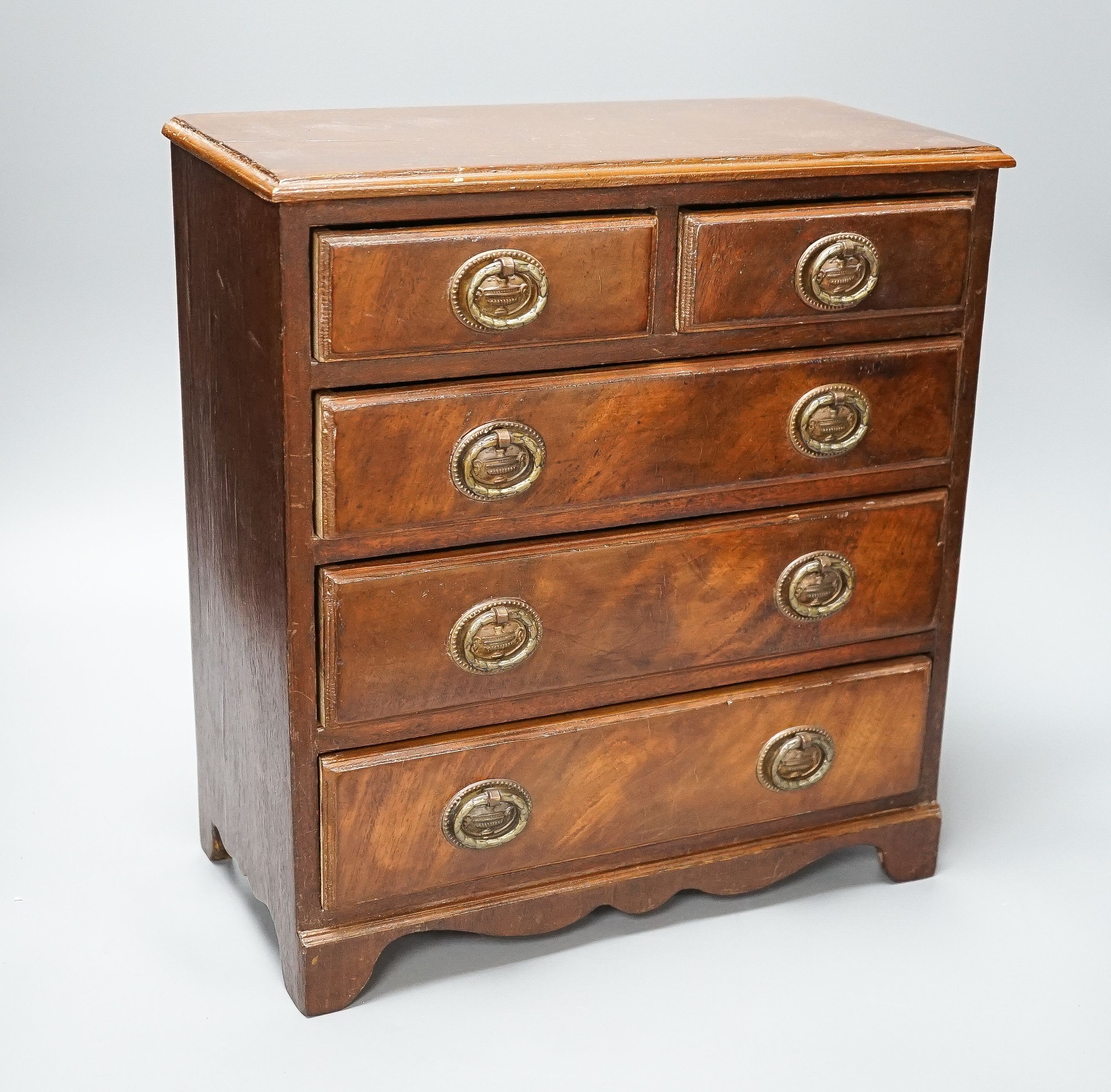 A 19th century mahogany miniature chest of drawers 35cm high, 33cm wide